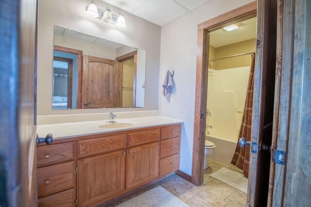 full bathroom with vanity, toilet, shower / bath combo, and tile patterned flooring