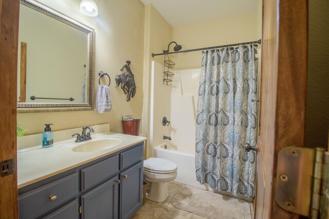 full bathroom with toilet, vanity, shower / bathtub combination with curtain, and tile patterned floors