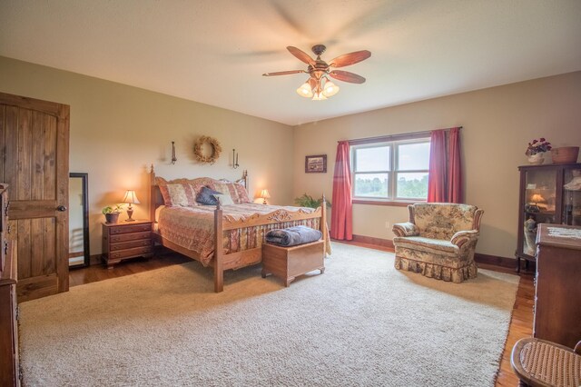 bedroom featuring wood-type flooring and ceiling fan