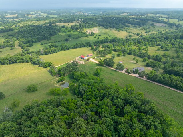 birds eye view of property with a rural view