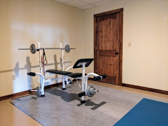 workout room featuring a drop ceiling