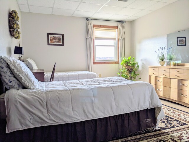 bedroom featuring a drop ceiling