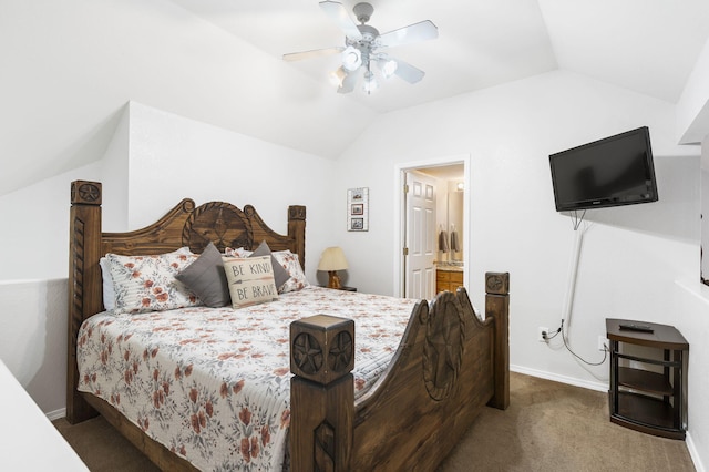 carpeted bedroom with ensuite bathroom, ceiling fan, and vaulted ceiling