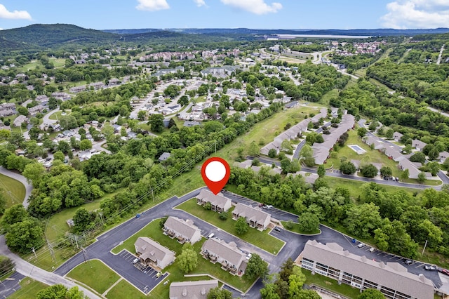 birds eye view of property with a mountain view