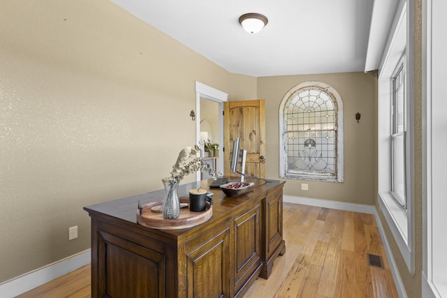 office area featuring a healthy amount of sunlight and light hardwood / wood-style floors