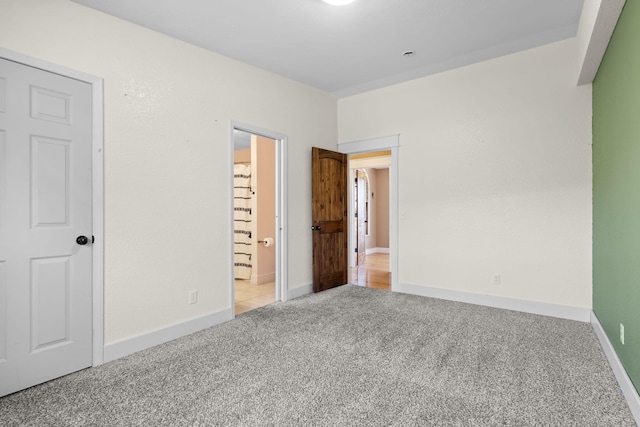 unfurnished bedroom featuring light colored carpet