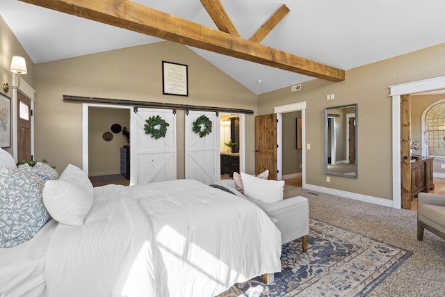 bedroom with a barn door, ensuite bathroom, carpet flooring, and lofted ceiling with beams