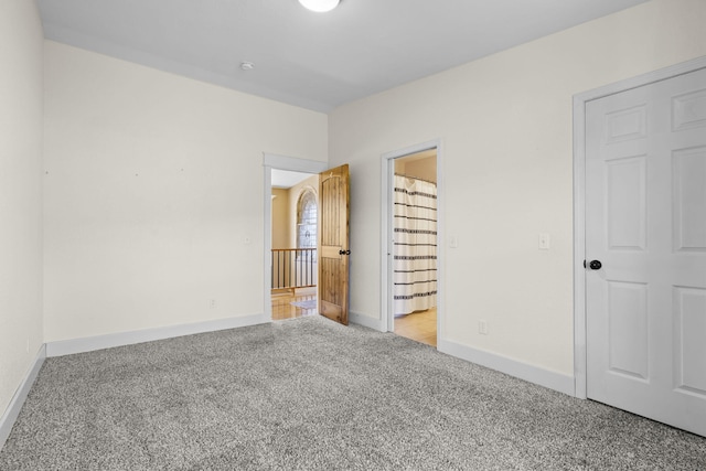 unfurnished bedroom featuring light colored carpet