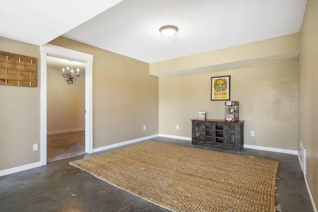 unfurnished living room featuring an inviting chandelier