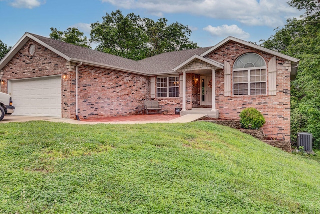 view of front of home with a garage and a front lawn