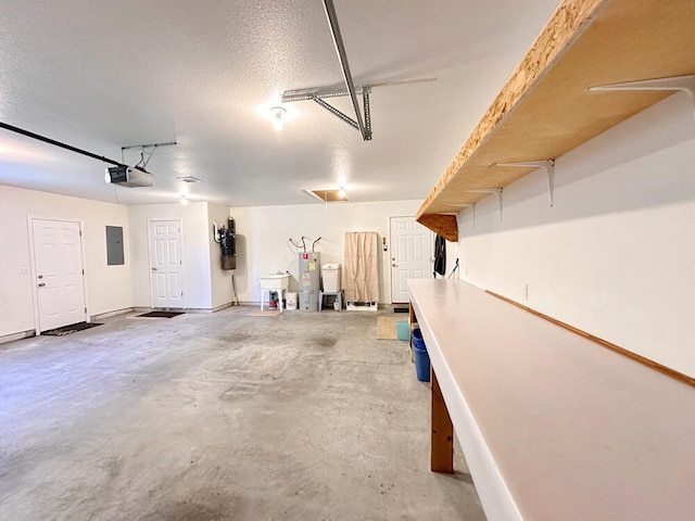 garage with a garage door opener, electric panel, and electric water heater