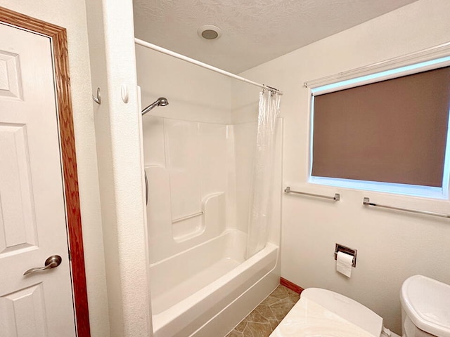 full bathroom with vanity, a textured ceiling, toilet, and shower / bathtub combination with curtain