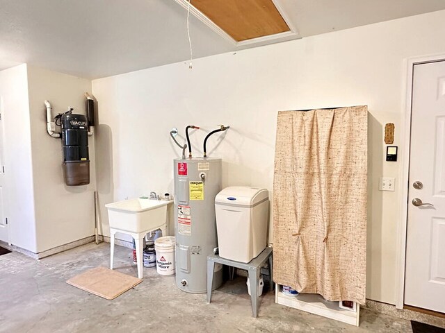 interior space with electric water heater and sink