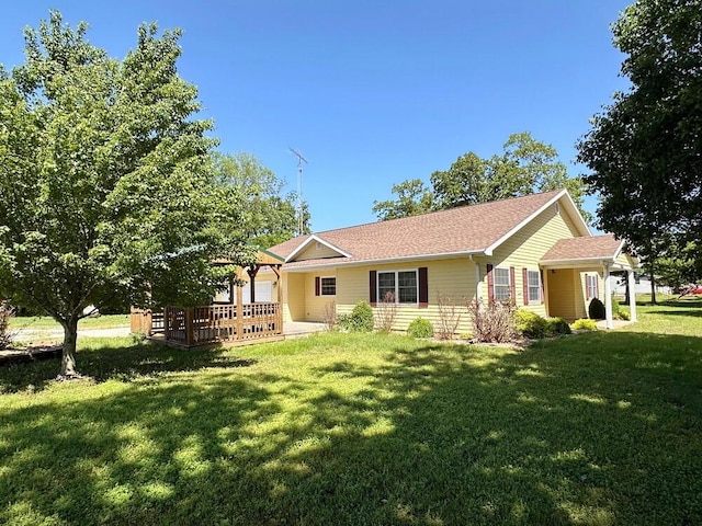 single story home featuring a front lawn