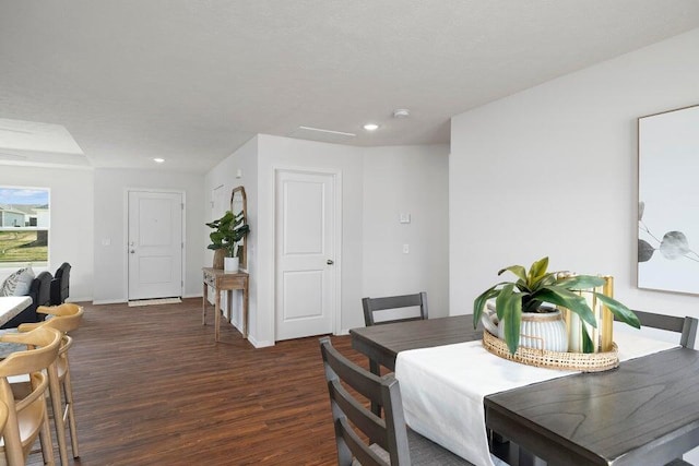 dining room with dark hardwood / wood-style flooring