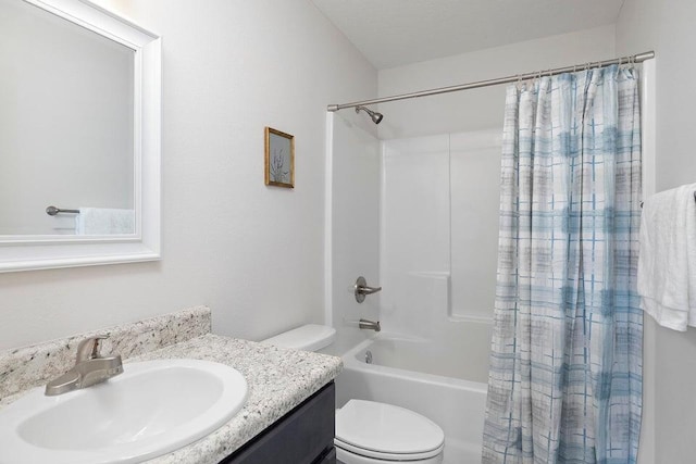 full bathroom with shower / bath combo, vanity, and toilet