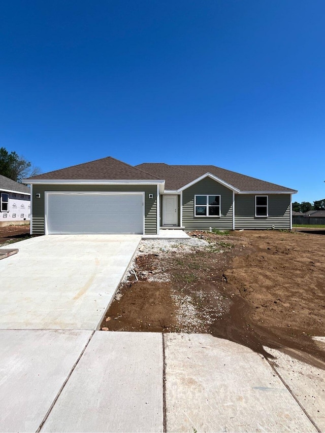 ranch-style house featuring a garage