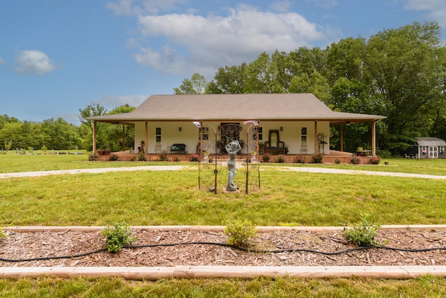 country-style home featuring covered porch and a front yard