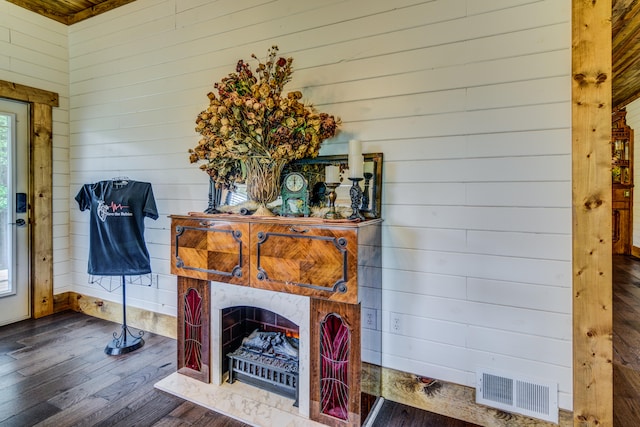 interior space featuring wooden walls and hardwood / wood-style floors