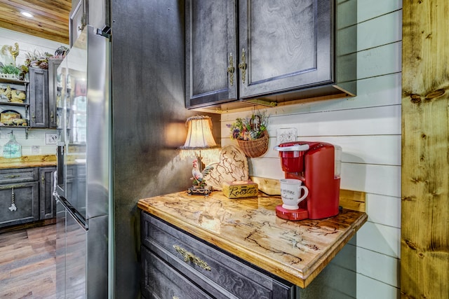 kitchen with light wood-type flooring and wooden counters