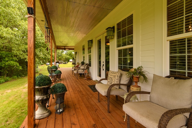 wooden deck with a lawn