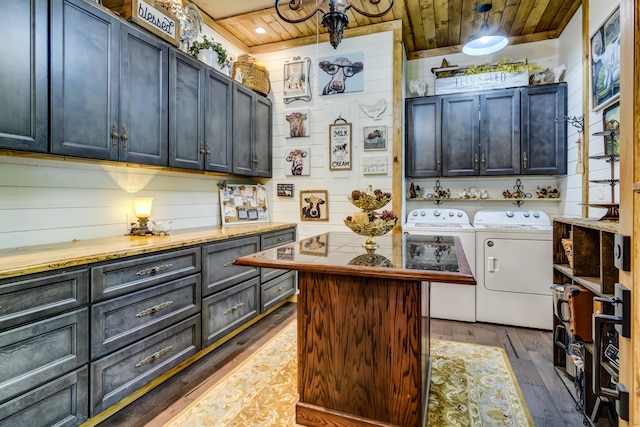 interior space featuring separate washer and dryer, wood ceiling, dark wood-type flooring, and a kitchen island