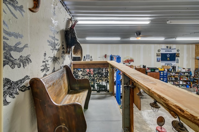 interior space with butcher block countertops and concrete flooring