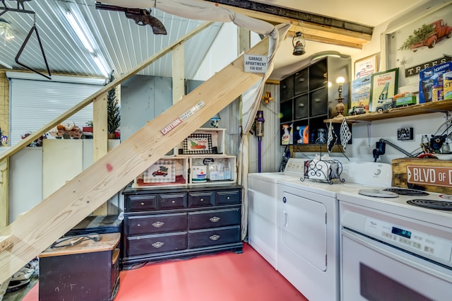 interior space with white oven and washer and clothes dryer