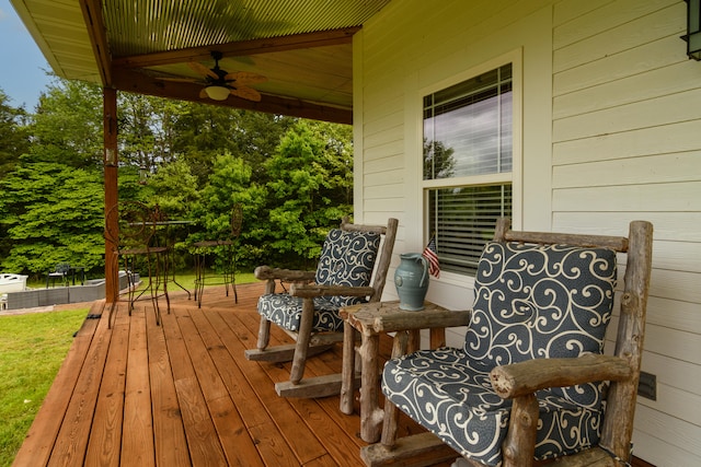 wooden deck featuring ceiling fan