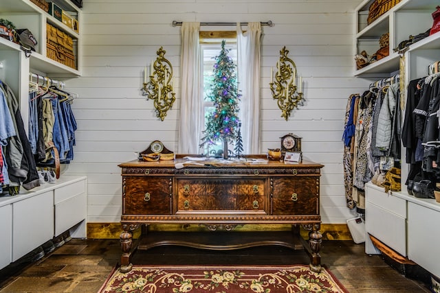 spacious closet featuring dark hardwood / wood-style floors