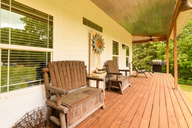 deck featuring grilling area and ceiling fan