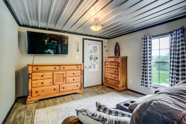 bedroom featuring hardwood / wood-style floors and multiple windows