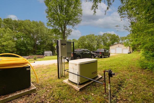 view of yard with a garage and an outdoor structure