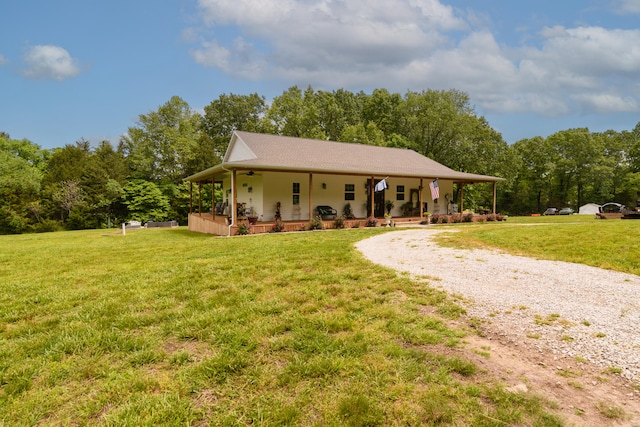 view of front of property with a porch and a front lawn