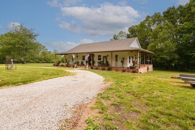 farmhouse with a front lawn and covered porch