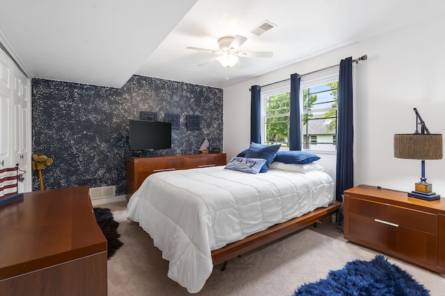 carpeted bedroom with a closet and ceiling fan