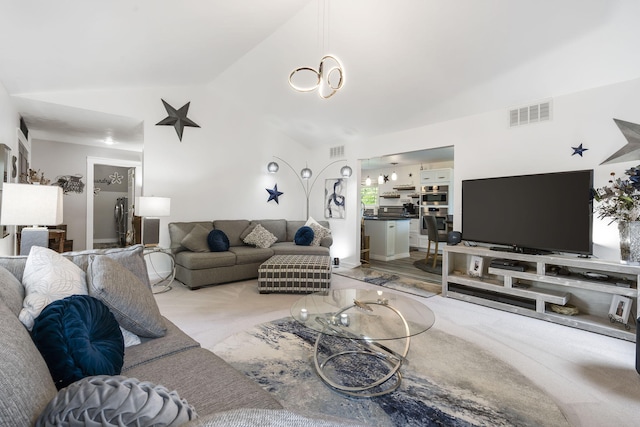 living room with light colored carpet and lofted ceiling