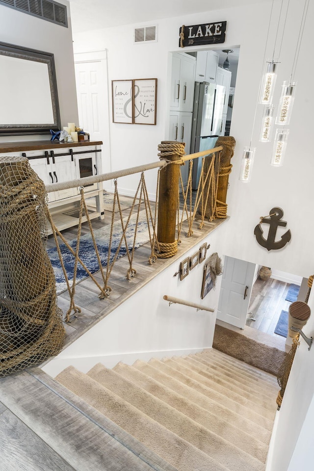 stairway featuring hardwood / wood-style flooring