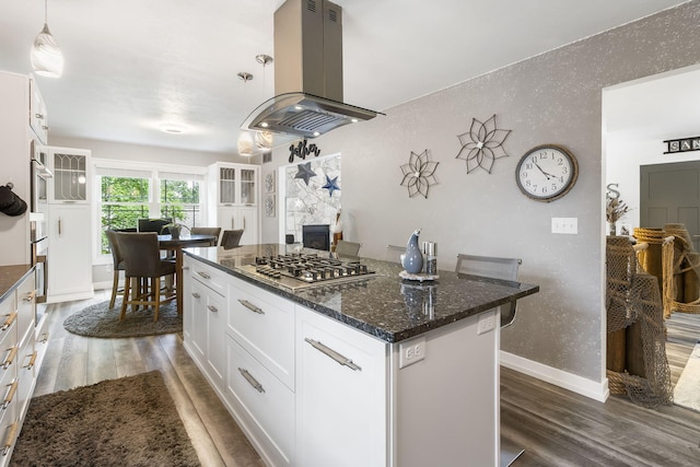 kitchen with white cabinets, pendant lighting, dark hardwood / wood-style flooring, and island exhaust hood