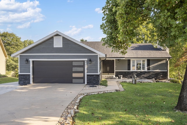 ranch-style home featuring an attached garage, a shingled roof, a front yard, stone siding, and driveway