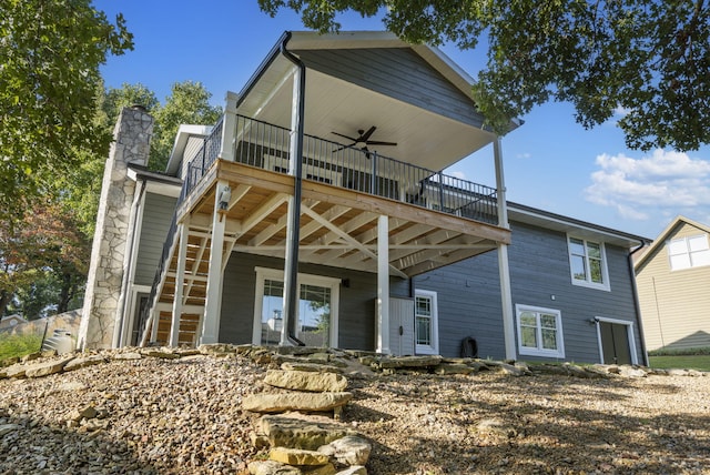 back of property with ceiling fan