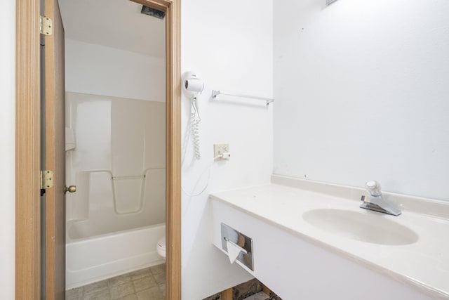 full bathroom featuring vanity, toilet, and  shower combination