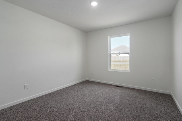 unfurnished room with carpet floors