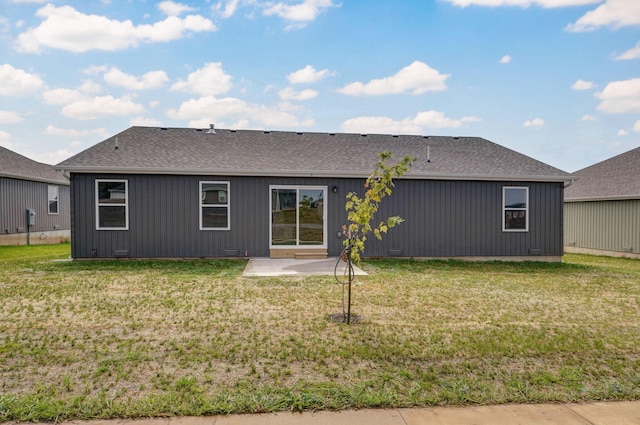 back of house featuring a yard and a patio