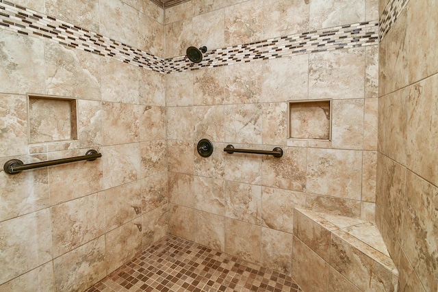 details featuring tiled shower