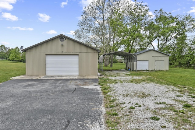 garage with a garage and aphalt driveway