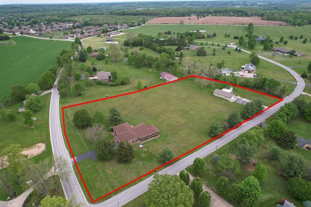 birds eye view of property featuring a rural view