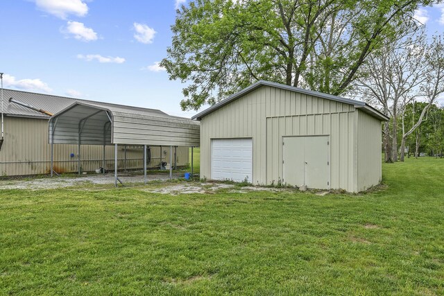 view of outbuilding with an outdoor structure, a detached carport, and driveway