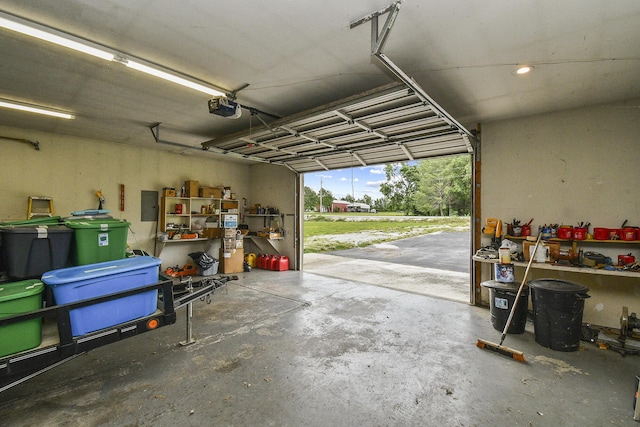 garage featuring a garage door opener and electric panel