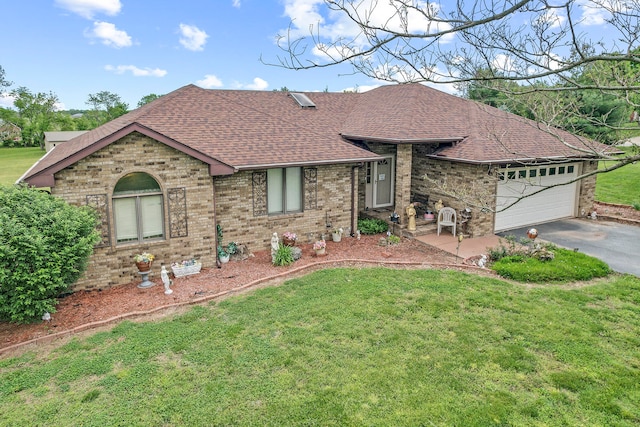 ranch-style house with a front yard and a garage